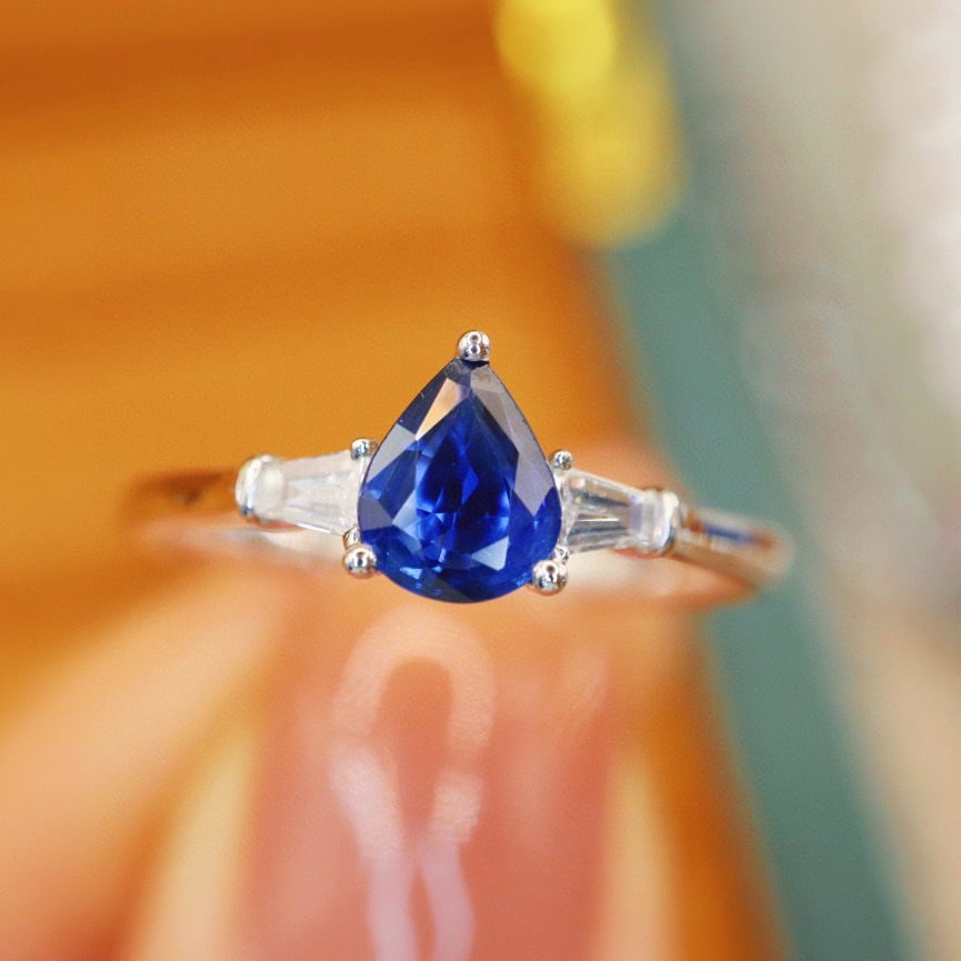 14k Gold 0.65 Ctw Natural Sapphire & Diamond Ring: Ref:230968113 // gold content:14k gold // ring size:7. 25us // // main gemstone:sapphire // shape:pear // carat weight:0. 55ct // color:blue // treatment:natural // // adjacent gemstone 2 : diamond