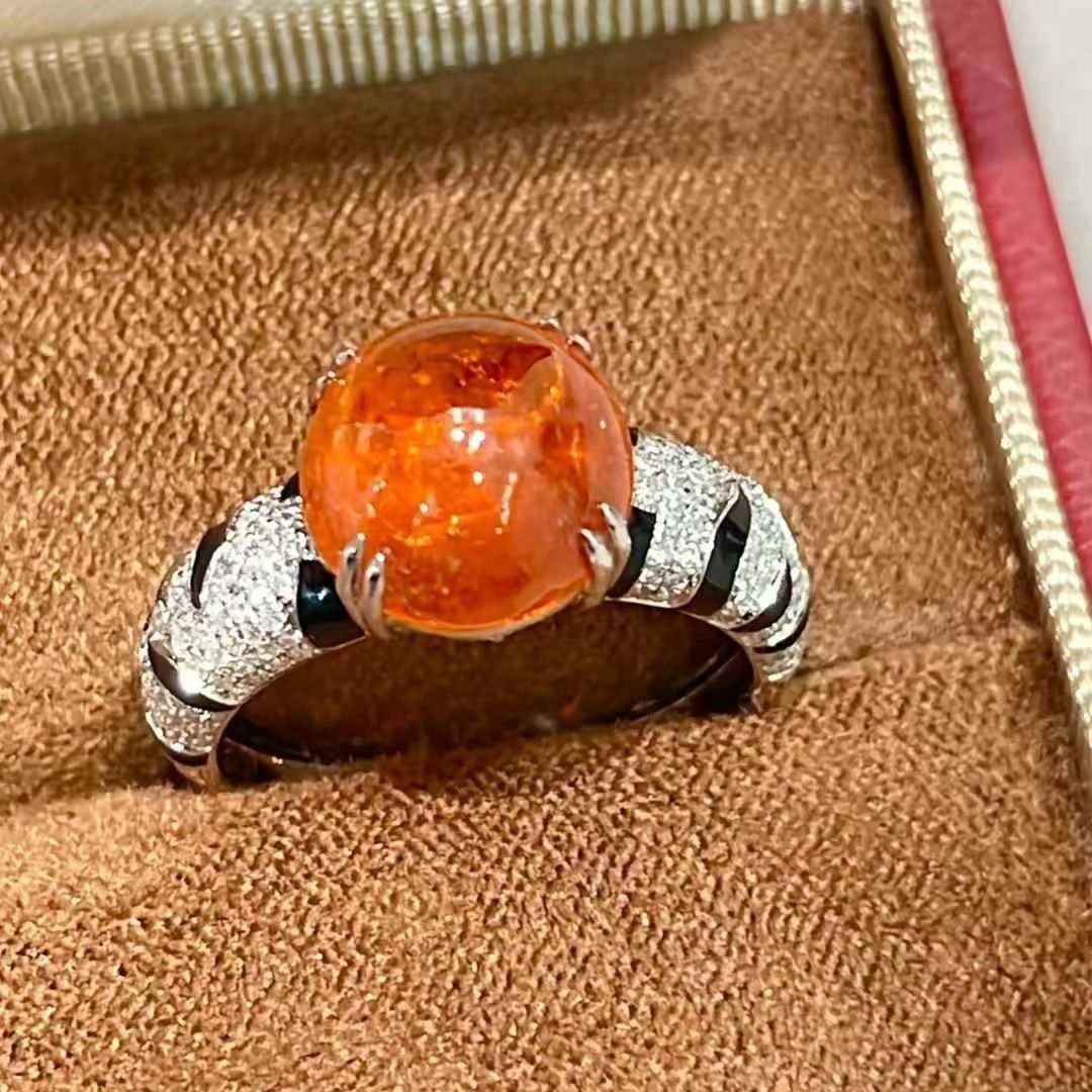 14k Gold 6.35 Ct Natural Spessartine & Diamond Ring: Ref:230968197 // gold content:14k gold // ring size:7. 25us // // main gemstone:spessartine // shape:oval // carat weight:6. 35ct // color:orange // treatment:natural // // adjacent gemstone 2 :