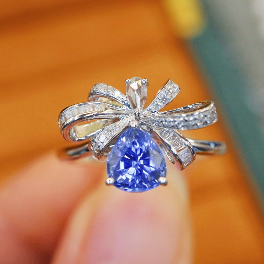 14k Gold 1.43 Ctw Natural Sapphire & Diamond Ring: Ref:230968301 // gold content:14k gold // ring size:7. 25us // // main gemstone:sapphire // shape:pear // carat weight:1. 22ct // color:cornflower blue // treatment:natural // // adjacent gemstone 2