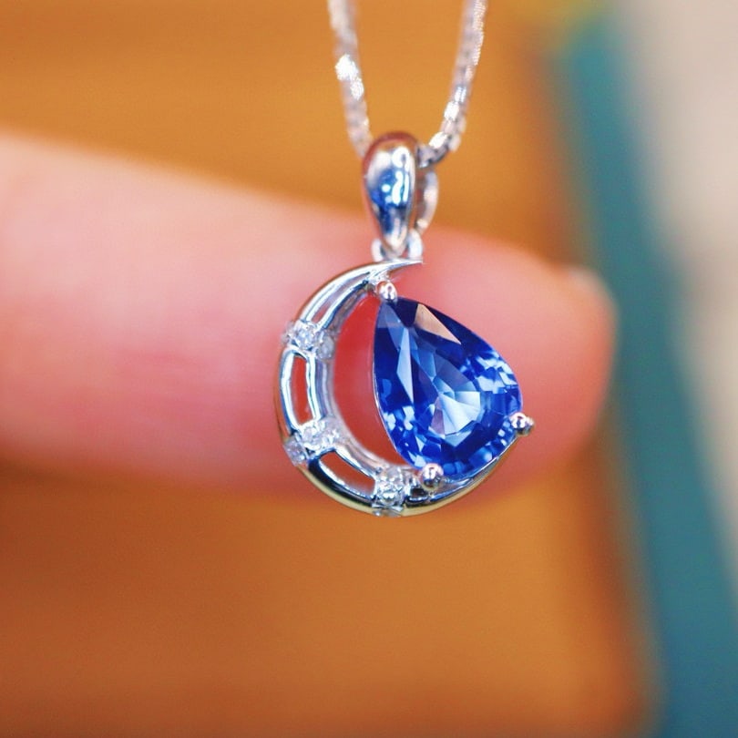 14k Gold 0.94 Ctw Natural Sapphire & Diamond Pendant( Without Chain ): Ref:230968309 // gold content:14k gold // main gemstone:sapphire // shape:pear // carat weight:0. 92ct // color:blue // treatment:natural // // adjacent gemstone 2 : diamond // number of stones:9 // s