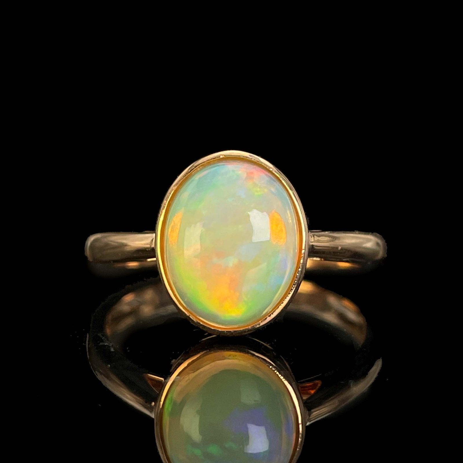 14k Gold 1.65 Ct Natural Opal Ring: Ref:230969003 // gold content:14k gold // ring size:7. 25us // // main gemstone:opal // shape:oval // carat weight:1. 65ct // color:color // treatment:natural // Condition: New Low Estimate: 1100