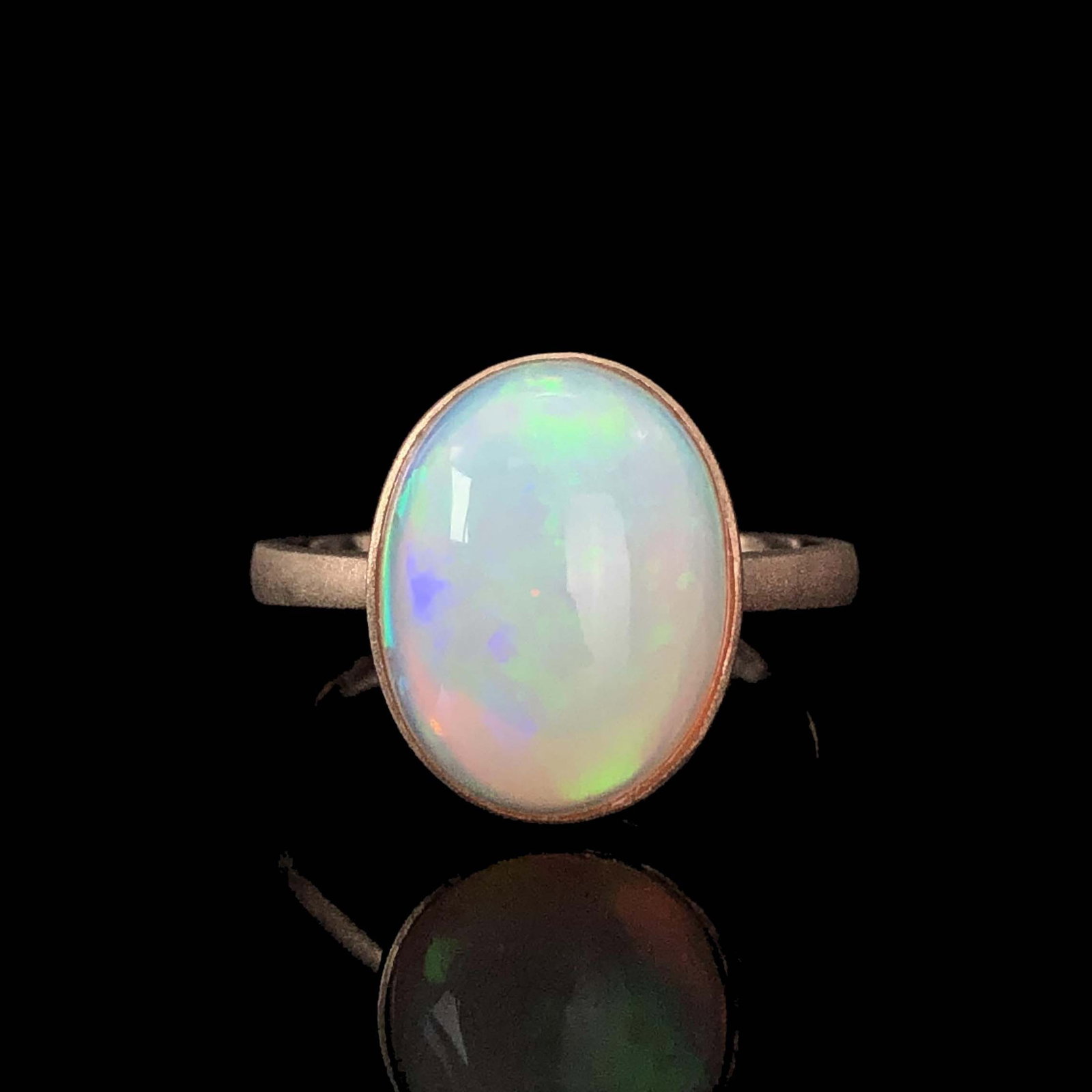 14k Gold 3.9 Ct Natural Opal Ring: Ref:230969065 // gold content:14k gold // ring size:7. 25us // // main gemstone:opal // shape:oval // carat weight:3. 9ct // color:color // treatment:natural // Condition: New Low Estimate: 1100 High