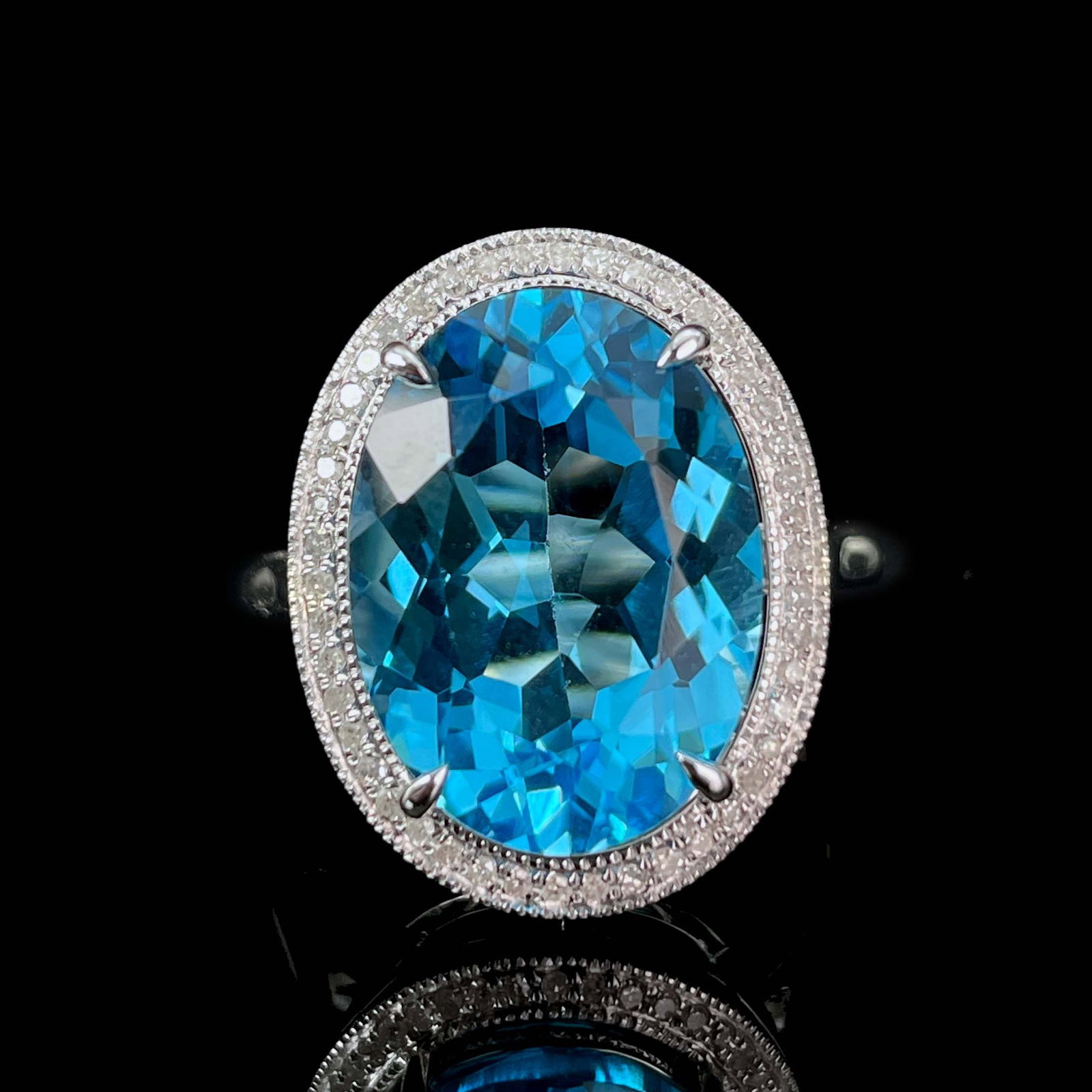 14k Gold 7.53 Ctw Natural Topaz & Diamond Ring: Ref:230969154 // gold content:14k gold // ring size:7. 25us // // main gemstone:topaz // shape:oval // carat weight:7. 4ct // color:swiss blue // treatment:natural // // adjacent gemstone 2 : diamond