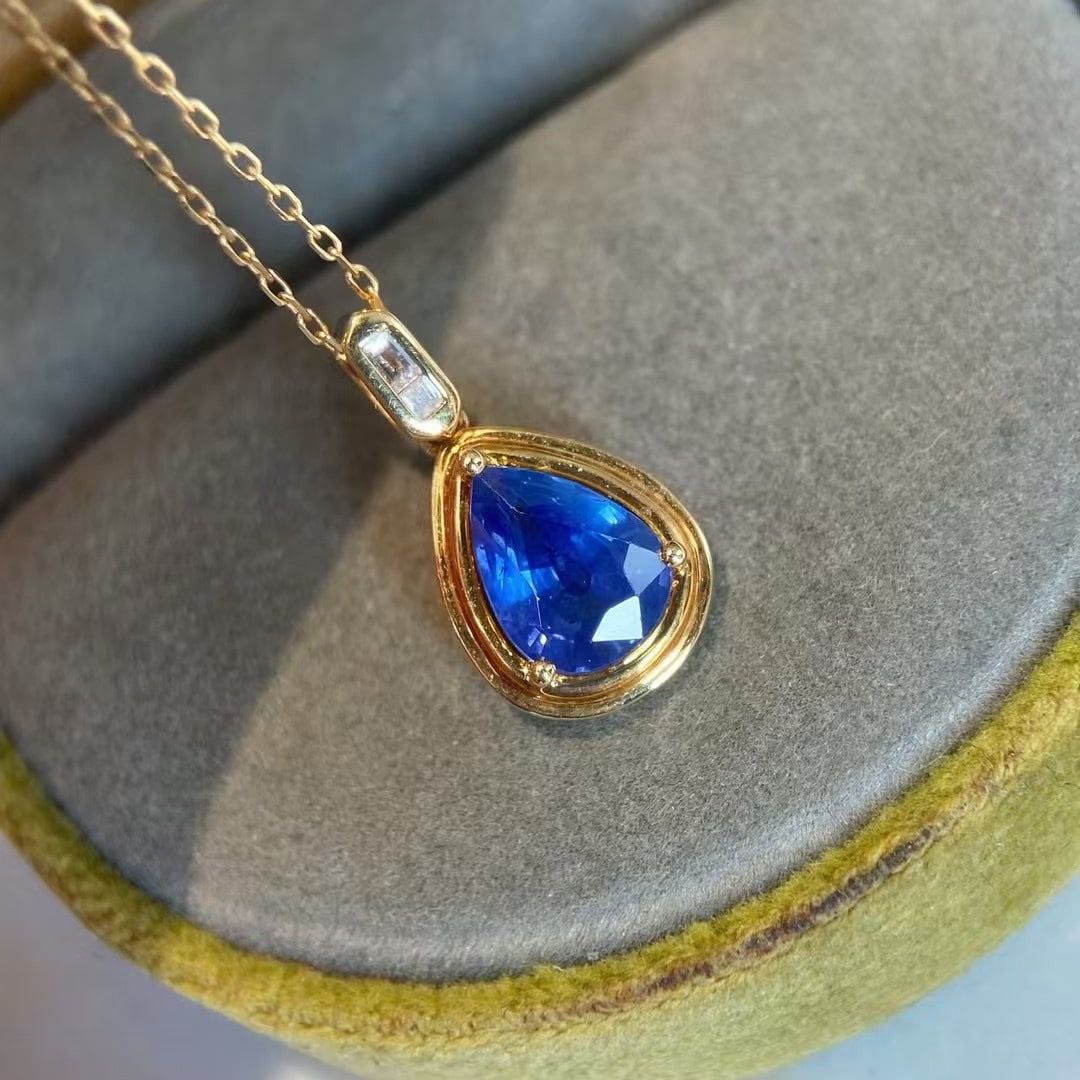 14k Gold 1.4 Ct Natural Sapphire & Diamond Pendant( Without Chain ): Ref:230969037 // gold content:14k gold // main gemstone:sapphire // shape:pear // carat weight:1. 4ct // color:cornflower blue // treatment:natural // // adjacent gemstone 2 : diamond // shape:baguett