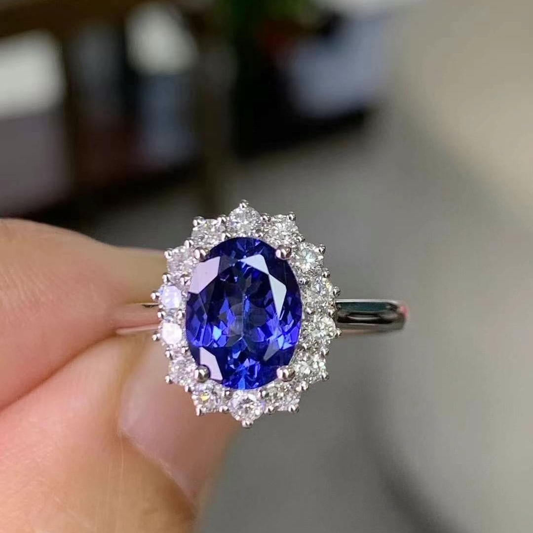 14k Gold 2.14 Ctw Natural Tanzanite & Diamond Ring: Ref:230969103 // gold content:14k gold // ring size:7. 25us // // main gemstone:tanzanite // shape:oval // carat weight:1. 65ct // color:blue // treatment:natural // // adjacent gemstone 2 : diamond