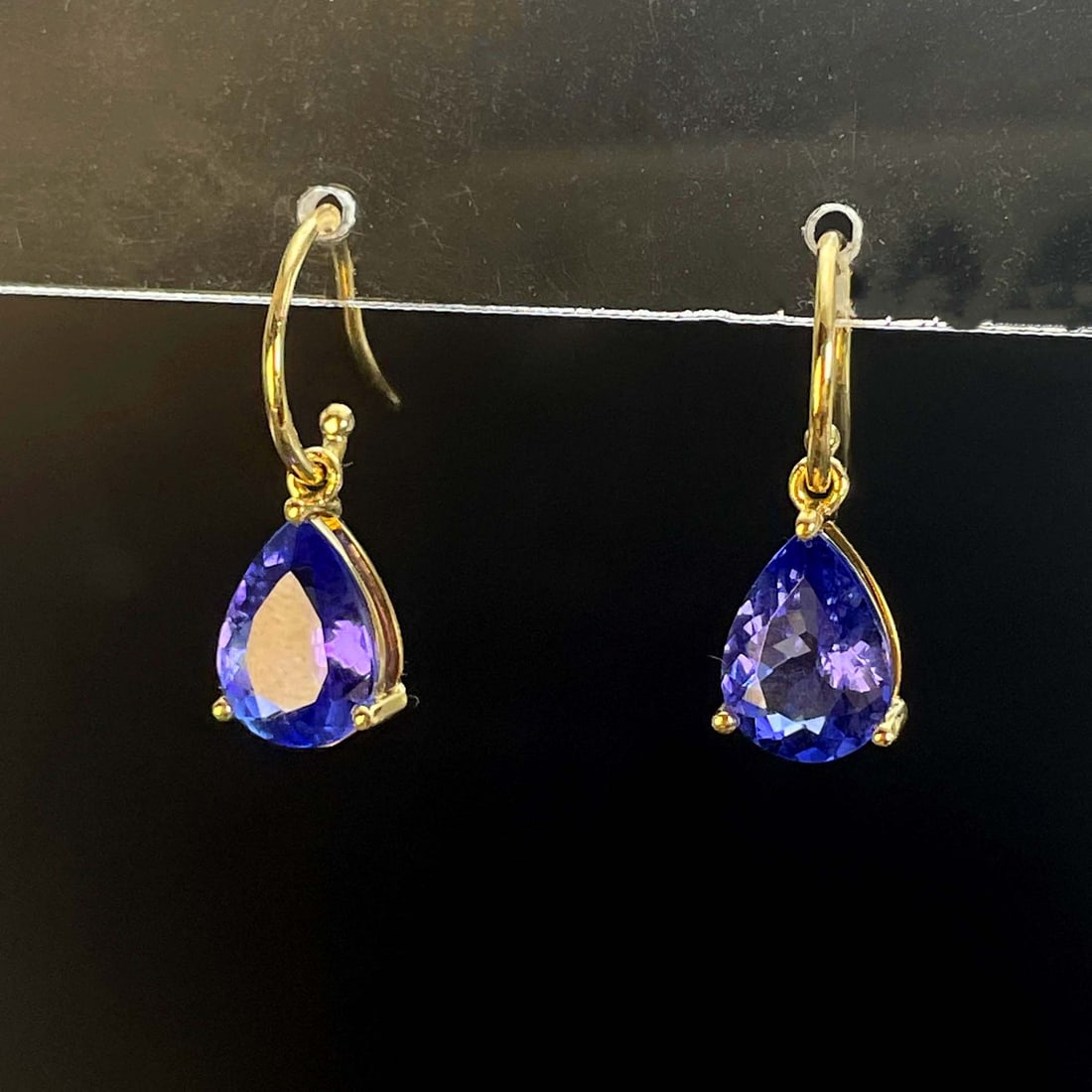14k Gold 2 Ct Natural Tanzanite Earrings: Ref:230969185 // gold content:14k gold // main gemstone:tanzanite // shape:pear // carat weight:2ct // color:blue // treatment:natural // Condition: New High Estimate: 2500 Low Estimate: 1700