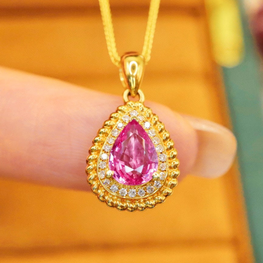 14k Gold 0.99 Ctw Natural Padparadscha Sapphire & Diamond Pendant( Without Chain ): Ref:230970166 // gold content:14k gold // main gemstone:padparadscha sapphire // shape:pear // carat weight:0. 92ct // color:orangish pink // treatment:natural // // adjacent gemstone 2 : diamond //