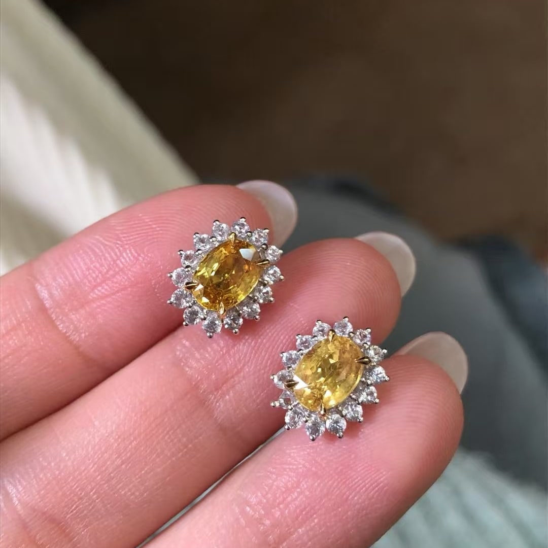 14k Gold 3.12 Ctw Natural Sapphire & Sapphire Earrings: Ref:230969250 // gold content:14k gold // main gemstone:sapphire // shape:oval // carat weight:2. 33ct // color:yellow // treatment:natural // // adjacent gemstone 2 : sapphire // shape:round //