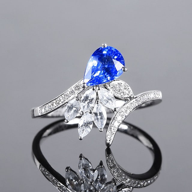 14k Gold 1.02 Ctw Natural Sapphire & Diamond Ring: Ref:230970008 // gold content:14k gold // ring size:7. 25us // // main gemstone:sapphire // shape:pear // carat weight:0. 93ct // color:cornflower blue // treatment:natural // // adjacent gemstone 2