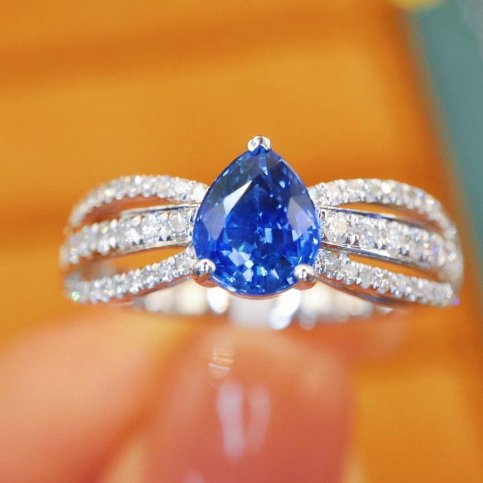 14k Gold 1.34 Ctw Natural Sapphire & Diamond Ring: Ref:230970239 // gold content:14k gold // ring size:7. 25us // // main gemstone:sapphire // shape:pear // carat weight:1. 06ct // color:cornflower blue // treatment:natural // // adjacent gemstone 2