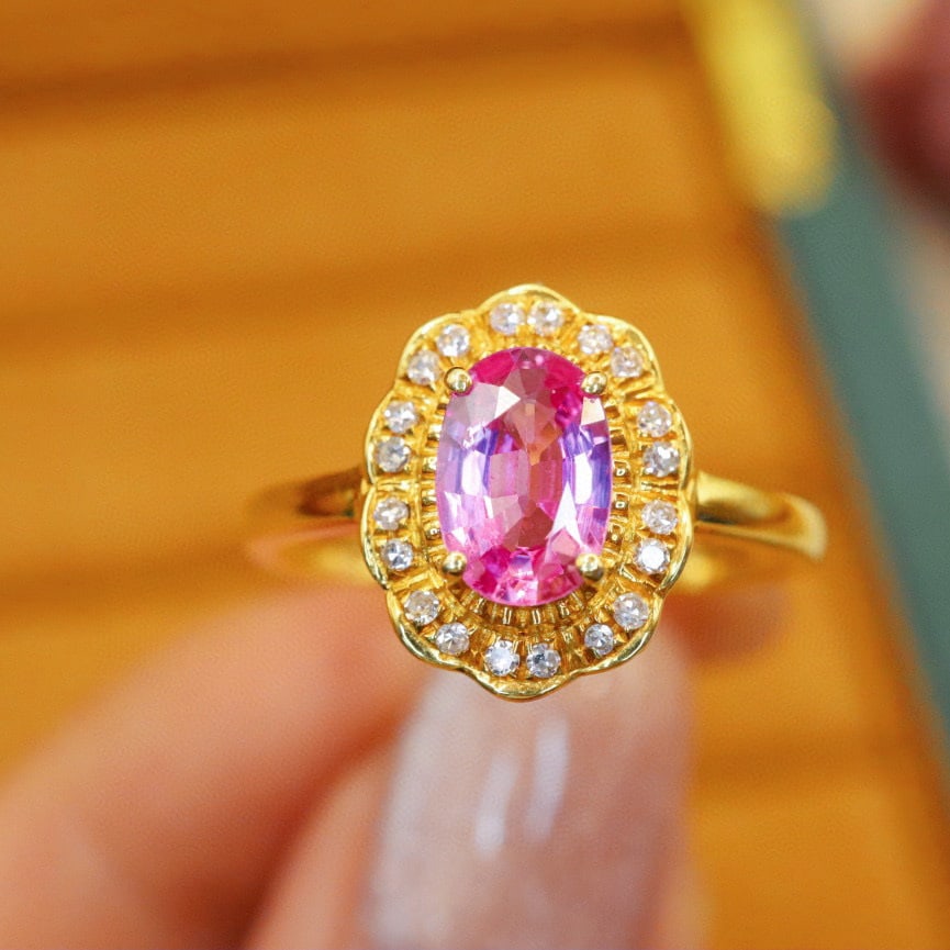 14k Gold 0.93 Ctw Natural Padparadscha Sapphire & Diamond Ring: Ref:230970142 // gold content:14k gold // ring size:7. 25us // // main gemstone:padparadscha sapphire // shape:oval // carat weight:0. 83ct // color:orangish pink // treatment:natural // // adjacent