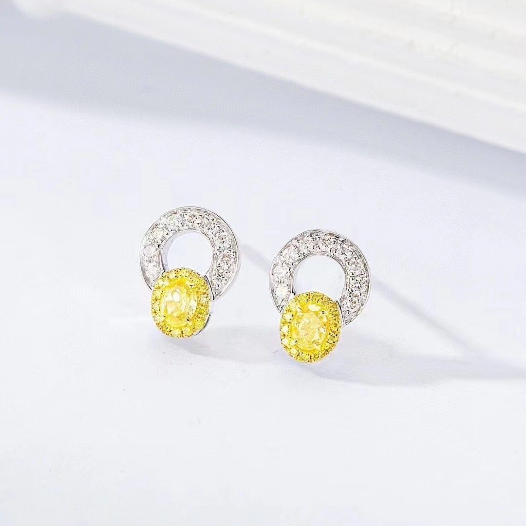 14k Gold 0.34 Ctw Natural Yellow Diamond & Diamond Earrings: Ref:230971008 // gold content:14k gold // main gemstone:yellow diamond // shape:oval // carat weight:0. 18ct // color:yellow // treatment:natural // // adjacent gemstone 2 : diamond // shape:round //