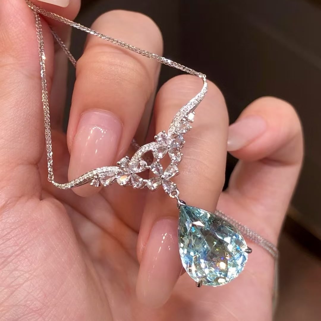 14k Gold 8.14 Ctw Natural Aquamarine & Sapphire Necklace: Ref:230971048 // gold content:14k gold // main gemstone:aquamarine // shape:pear // carat weight:7. 38ct // color:blue // treatment:natural // // adjacent gemstone 2 : sapphire // shape:multiply //
