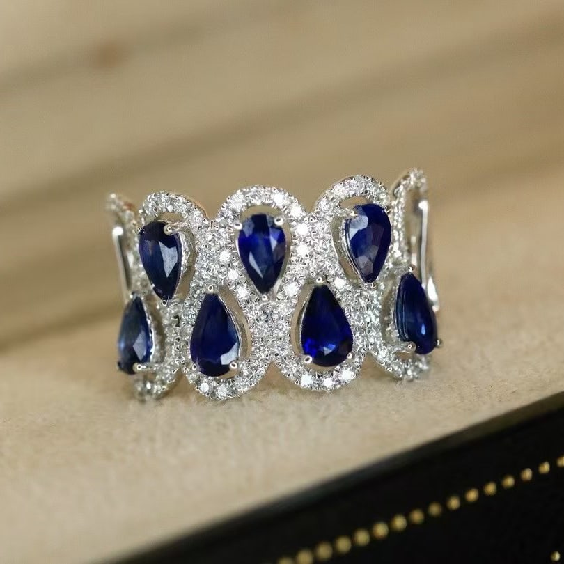 14k Gold 2.41 Ctw Vivid Blue Natural Sapphire & Diamond Ring: Ref:230971052 // gold content:14k gold // ring size:7. 25us // // main gemstone:sapphire // shape:pear // carat weight:1. 91ct // color:vivid blue // treatment:natural // // adjacent gemstone 2 :