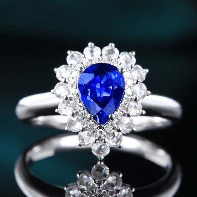 14k Gold 1.69 Ctw Natural Sapphire & Diamond Ring: Ref:230972179 // gold content:14k gold // ring size:7. 25us // // main gemstone:sapphire // shape:pear // carat weight:1. 25ct // color:blue // treatment:natural // // adjacent gemstone 2 : diamond