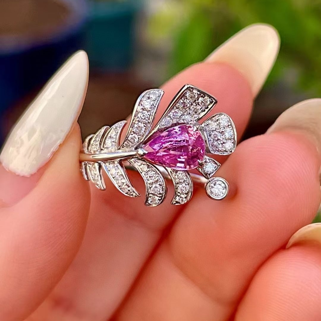 14k Gold 1.34 Ctw Natural Padparadscha Sapphire & Diamond Ring: Ref:230972293 // gold content:14k gold // ring size:7. 25us // // main gemstone:padparadscha sapphire // shape:pear // carat weight:1. 04ct // color:orangish pink // treatment:natural // // adjacent