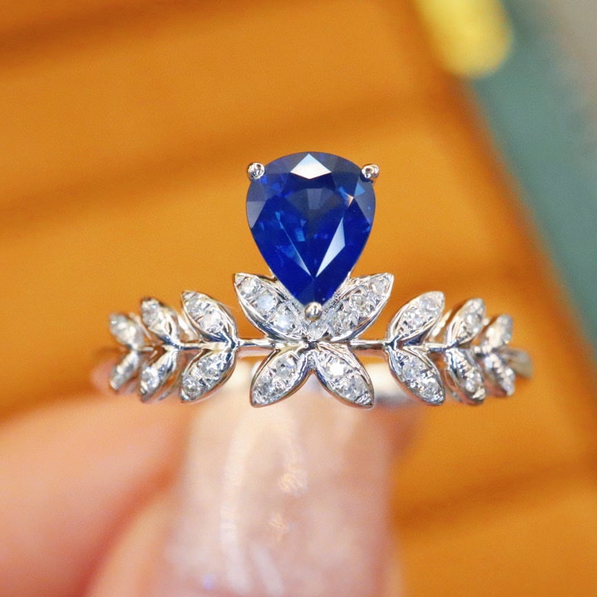 14k Gold 0.76 Ctw Natural Sapphire & Diamond Ring: Ref:230972355 // gold content:14k gold // ring size:7. 25us // // main gemstone:sapphire // shape:pear // carat weight:0. 68ct // color:blue // treatment:natural // // adjacent gemstone 2 : diamond