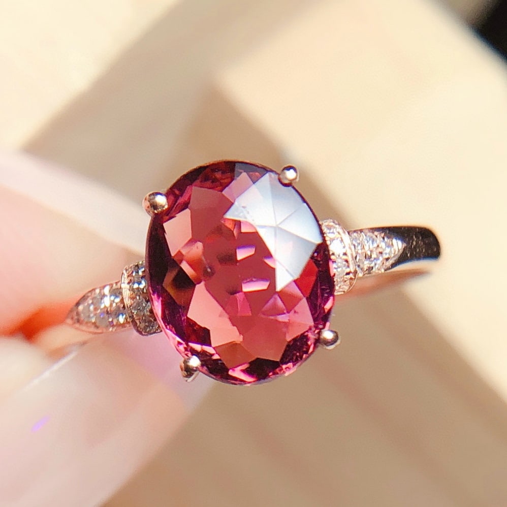 14k Gold 2.3 Ct Natural Tourmaline & Diamond Ring: Ref:230973103 // gold content:14k gold // ring size:7. 25us // // main gemstone:tourmaline // shape:oval // carat weight:2. 3ct // color:red // treatment:natural // // adjacent gemstone 2 : diamond