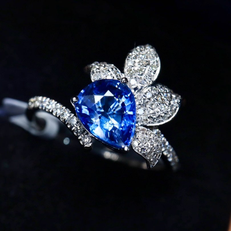 14k Gold 1.65 Ctw Natural Sapphire & Diamond Ring: Ref:230973113 // gold content:14k gold // ring size:7. 25us // // main gemstone:sapphire // shape:pear // carat weight:1. 37ct // color:cornflower blue // treatment:natural // // adjacent gemstone 2