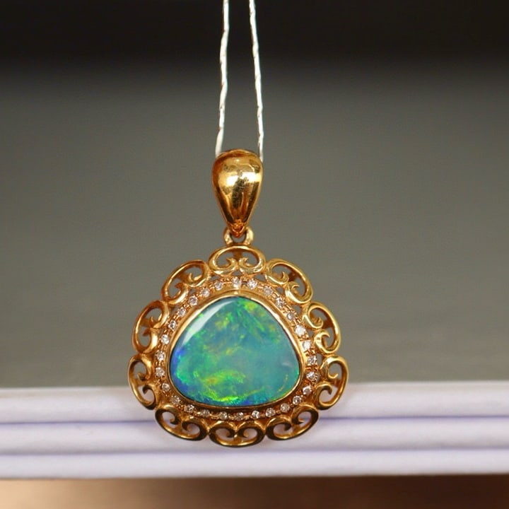 14k Gold 1.72 Ct Natural Opal & Diamond Pendant( Without Chain ): Ref:230975006 // gold content:14k gold // main gemstone:opal // shape:other // carat weight:1. 72ct // color:color // treatment:natural // // adjacent gemstone 2 : diamond // number of stones:31 //