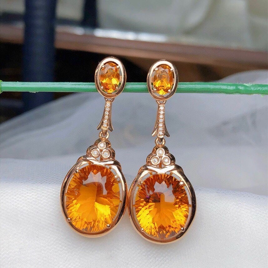 14k Gold 13.20 Ct Natural Citrine & Diamond Earrings: Ref:230975073 // gold content:14k gold // main gemstone:citrine // shape:oval // carat weight:13. 20ct // color:yellow // treatment:natural // // adjacent gemstone 2 : diamond // number of stones:19