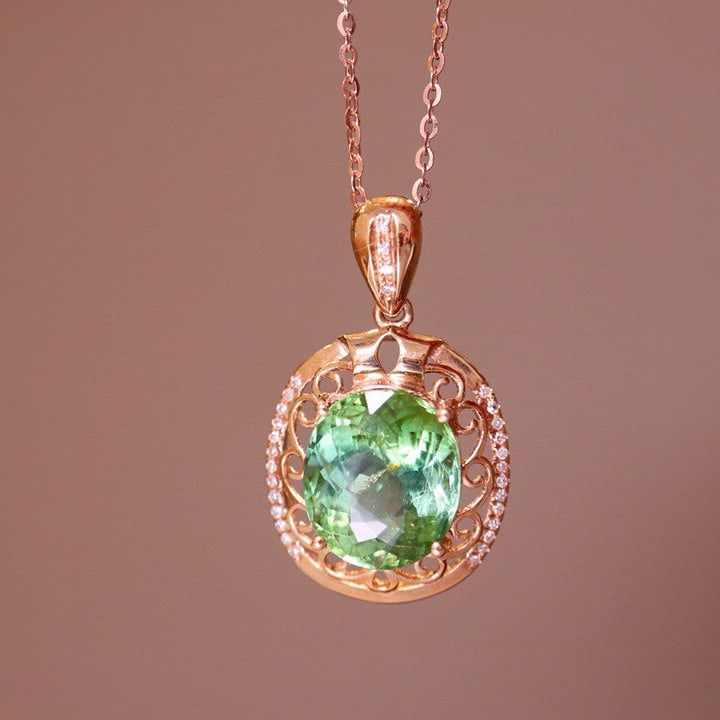 14k Gold 4.1 Ct Natural Tourmaline & Diamond Pendant( Without Chain ): Ref:230975108 // gold content:14k gold // main gemstone:tourmaline // shape:oval // carat weight:4. 1ct // color:green // treatment:natural // // adjacent gemstone 2 : diamond // number of stones:30