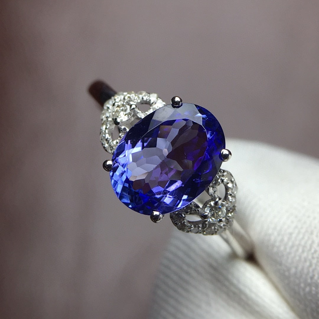 14k Gold 2.2 Ct Natural Tanzanite & Diamond Ring: Ref:230975113 // gold content:14k gold // ring size:7. 25us // // main gemstone:tanzanite // shape:oval // carat weight:2. 2ct // color:blue // treatment:natural // // adjacent gemstone 2 : diamond