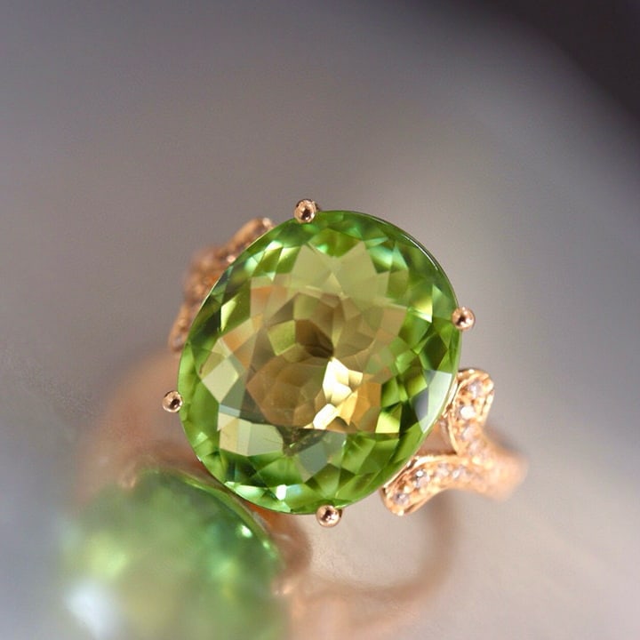 14k Gold 7.9 Ct Natural Tourmaline & Diamond Ring: Ref:230975117 // gold content:14k gold // ring size:7. 25us // // main gemstone:tourmaline // shape:oval // carat weight:7. 9ct // color:green // treatment:natural // // adjacent gemstone 2 : diamond