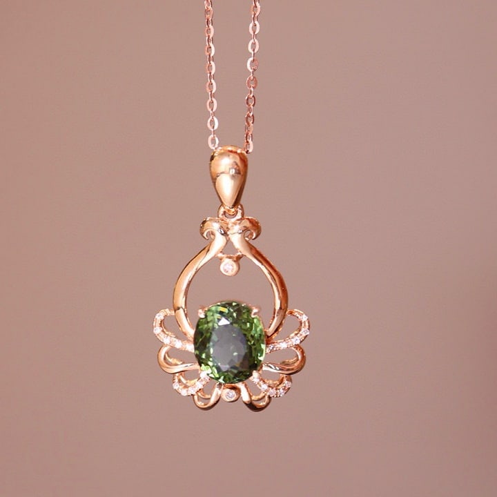 14k Gold 2.32 Ct Natural Tourmaline & Diamond Pendant( Without Chain ): Ref:230975173 // gold content:14k gold // main gemstone:tourmaline // shape:oval // carat weight:2. 32ct // color:green // treatment:natural // // adjacent gemstone 2 : diamond // number of stones:22