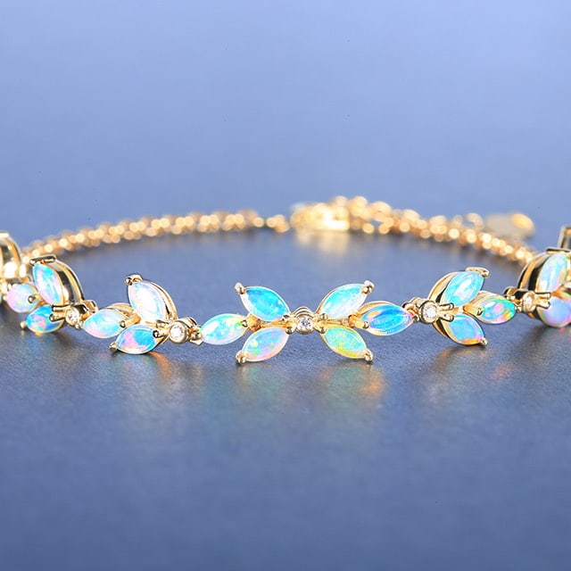 14k Gold 2.10 Ctw Natural Opal & Diamond Bracelet: Ref:230976115 // gold content:14k gold // main gemstone:opal // shape:marquise // carat weight:2. 03ct // color:white // treatment:natural // // adjacent gemstone 2 : diamond // number of stones:7 // 