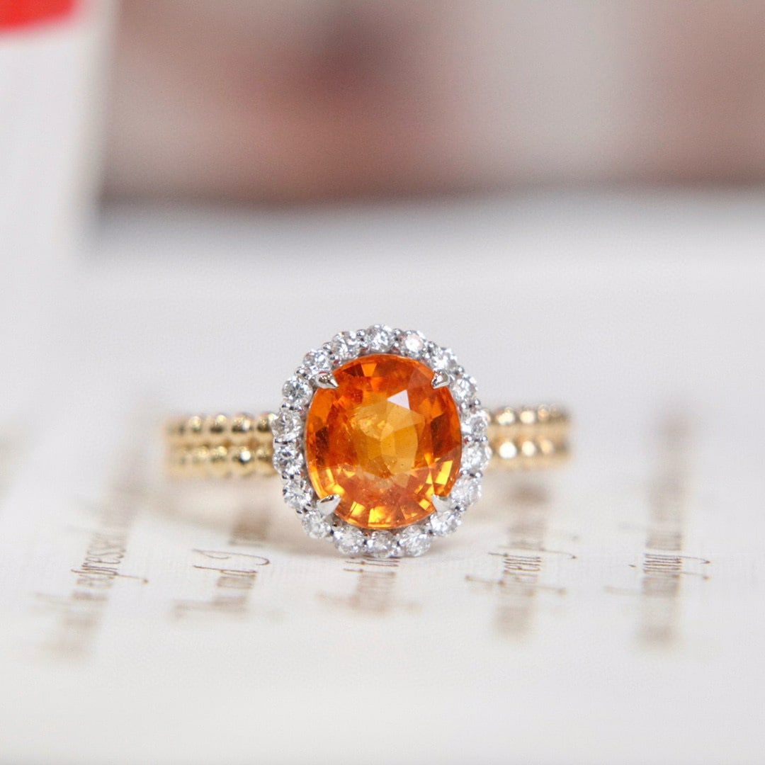 14k Gold 3.07 Ctw Natural Spessartine & Diamond Ring: Ref:230976153 // gold content:14k gold // ring size:7. 25us // // main gemstone:spessartine // shape:oval // carat weight:2. 8ct // color:orange // treatment:natural // // adjacent gemstone 2 : diamon