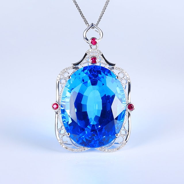 14k Gold 60.38 Ctw Natural Topaz & Diamond Pendant( Without Chain ): Ref:230976282 // gold content:14k gold // main gemstone:topaz // shape:oval // carat weight:60. 26ct // color:blue // treatment:natural // // adjacent gemstone 2 : diamond // number of stones:40 // sh