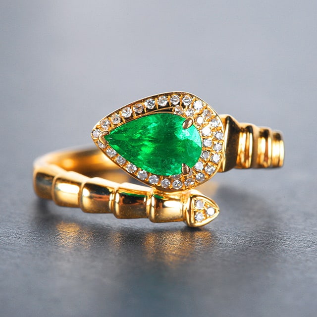14k Gold 0.86 Ctw Vivid Green Natural Emerald & Diamond Ring: Ref:230976295 // gold content:14k gold // ring size:7. 25us // // main gemstone:emerald // shape:pear // carat weight:0. 75ct // color:vivid green // treatment:natural // // adjacent gemstone 2 : diam