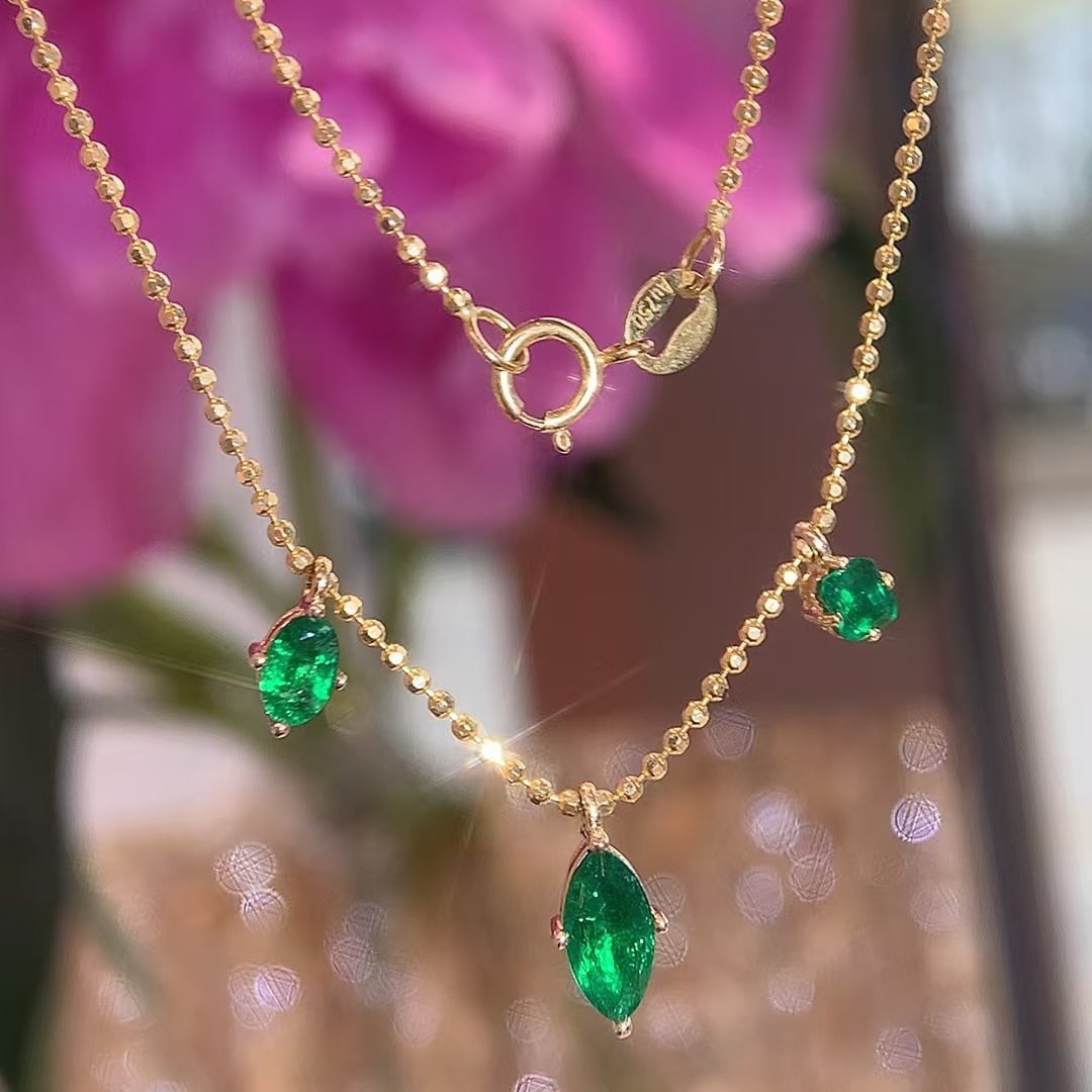 14k Gold 0.60 Ct Vivid Green Natural Emerald Necklace: Ref:230976392 // gold content:14k gold // main gemstone:emerald // shape:multiply // carat weight:0. 60ct // color:vivid green // treatment:natural // Condition: New Low Estimate: 2600.00 High