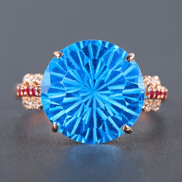 14k Gold 9.74 Ctw Natural Topaz & Diamond Ring: Ref:230976412 // gold content:14k gold // ring size:7. 25us // // main gemstone:topaz // shape:round // carat weight:9. 68ct // color:blue // treatment:natural // cut grade:g // // adjacent gemstone