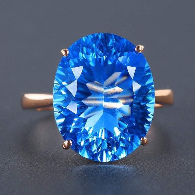 14k Gold 12.02 Ct Natural Topaz Ring: Ref:230976411 // gold content:14k gold // ring size:7. 25us // // main gemstone:topaz // shape:oval // carat weight:12. 02ct // color:blue // treatment:natural // Condition: New Low Estimate: 1700
