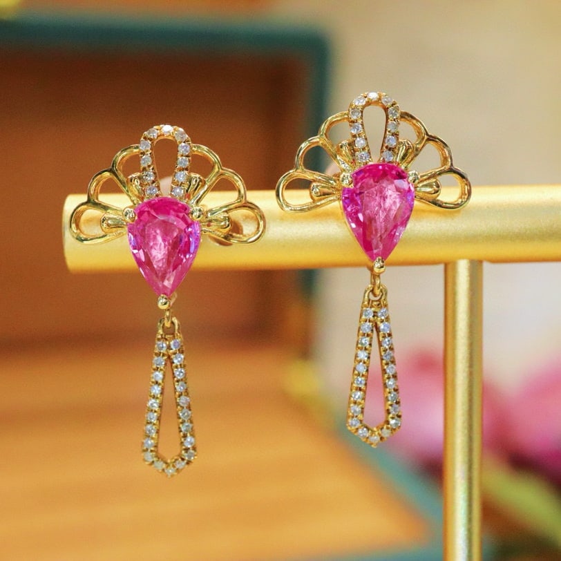 14k Gold 1.97 Ctw Natural Padparadscha Sapphire & Diamond Earrings: Ref:230976436 // gold content:14k gold // main gemstone:padparadscha sapphire // shape:pear // carat weight:1. 78ct // color:orangish pink // treatment:natural // // adjacent gemstone 2 : diamond //