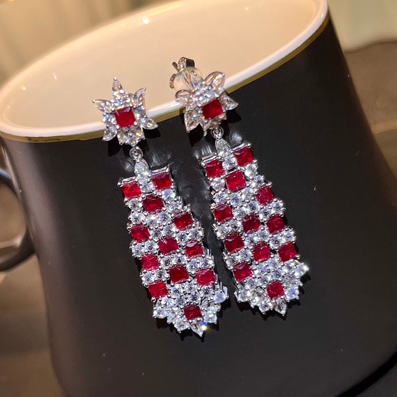 14k Gold 3.83 Ct Natural Ruby & Sapphire Earrings: Ref:230977040 // gold content:14k gold // main gemstone:ruby // shape:princess // carat weight:3. 83ct // color:red // treatment:natural // // adjacent gemstone 2 : sapphire // number of stones:90 //