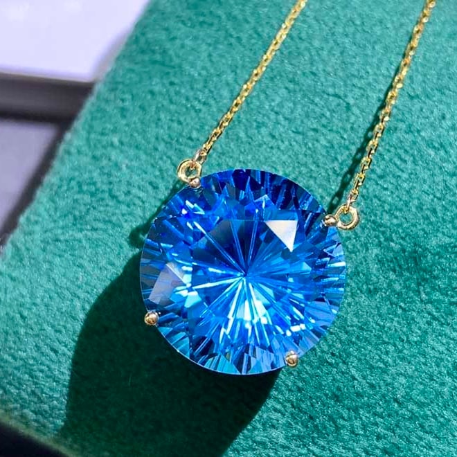 14k Gold 12 Ct Natural Topaz Necklace: Ref:230977006 // gold content:14k gold // main gemstone:topaz // shape:round // carat weight:12ct // color:blue // treatment:natural // cut grade:g // Condition: New High Estimate: 2800 Low Estimate: