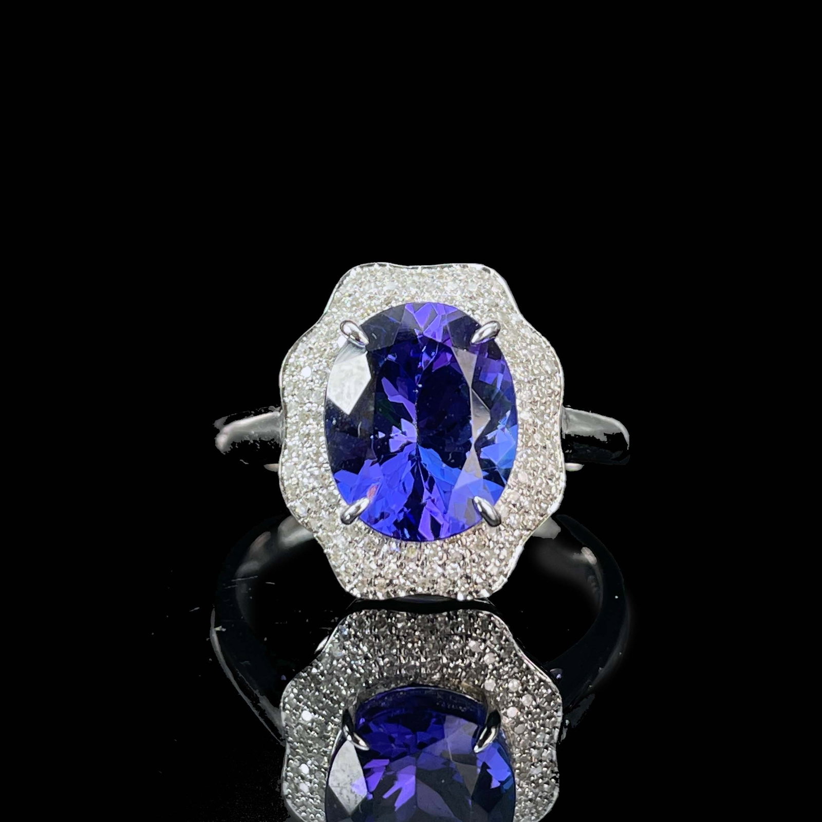 14k Gold 3.42 Ctw Natural Tanzanite & Diamond Ring: Ref:230977251 // gold content:14k gold // ring size:7. 25us // // main gemstone:tanzanite // shape:oval // carat weight:3. 1ct // color:blue // treatment:natural // // adjacent gemstone 2 : diamond