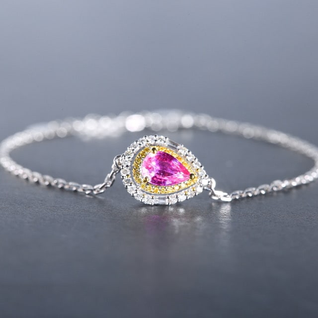 14k Gold 1.27 Ctw Natural Padparadscha Sapphire & Diamond Bracelet: Ref:230978048 // gold content:14k gold // main gemstone:padparadscha sapphire // shape:pear // carat weight:1. 02ct // color:orangish pink // treatment:natural // // adjacent gemstone 2 : diamond //