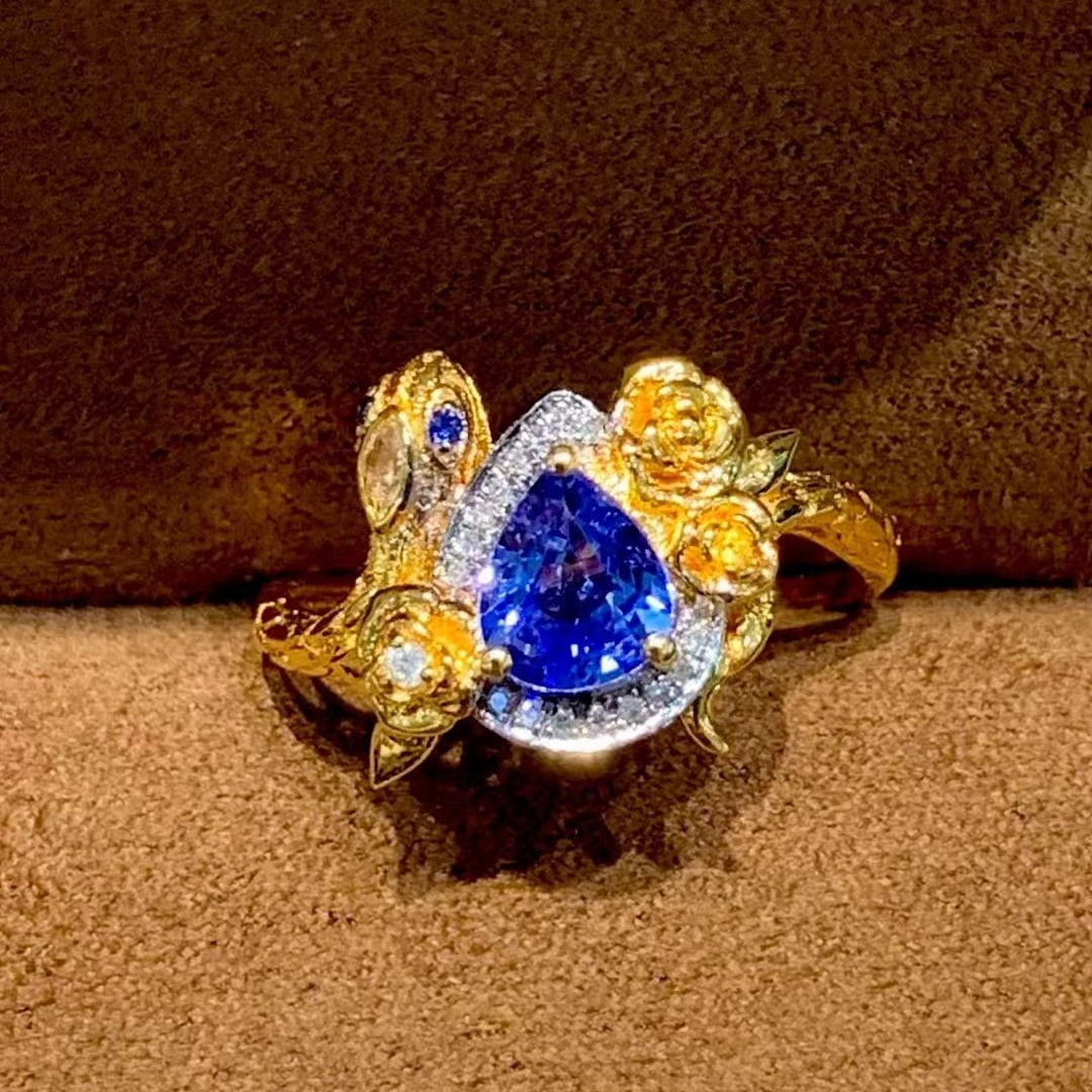 14k Gold 0.9 Ct Natural Sapphire & Diamond Ring: Ref:230978409 // gold content:14k gold // ring size:7. 25us // // main gemstone:sapphire // shape:pear // carat weight:0. 9ct // color:royal blue // treatment:natural // // adjacent gemstone 2 : diamo