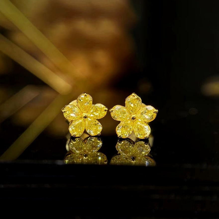 14k Gold 0.7 Ct Natural Yellow Diamond Earrings: Ref:230978371 // gold content:14k gold // main gemstone:yellow diamond // shape:pear // carat weight:0. 7ct // color:yellow // treatment:natural // Condition: New Low Estimate: 3500.00 High Estimate: