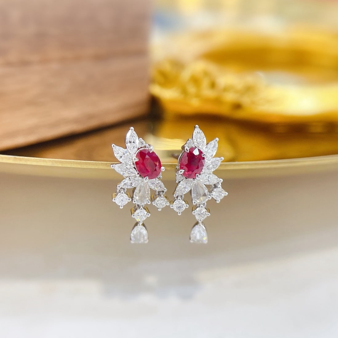 14k Gold 1.30 Ctw Natural Ruby & Diamond Earrings: Ref:231200095 // gold content:14k gold // main gemstone:ruby // shape:oval // carat weight:0. 56ct // color:red // treatment:natural // // adjacent gemstone 2 : diamond // shape:multiple // carat