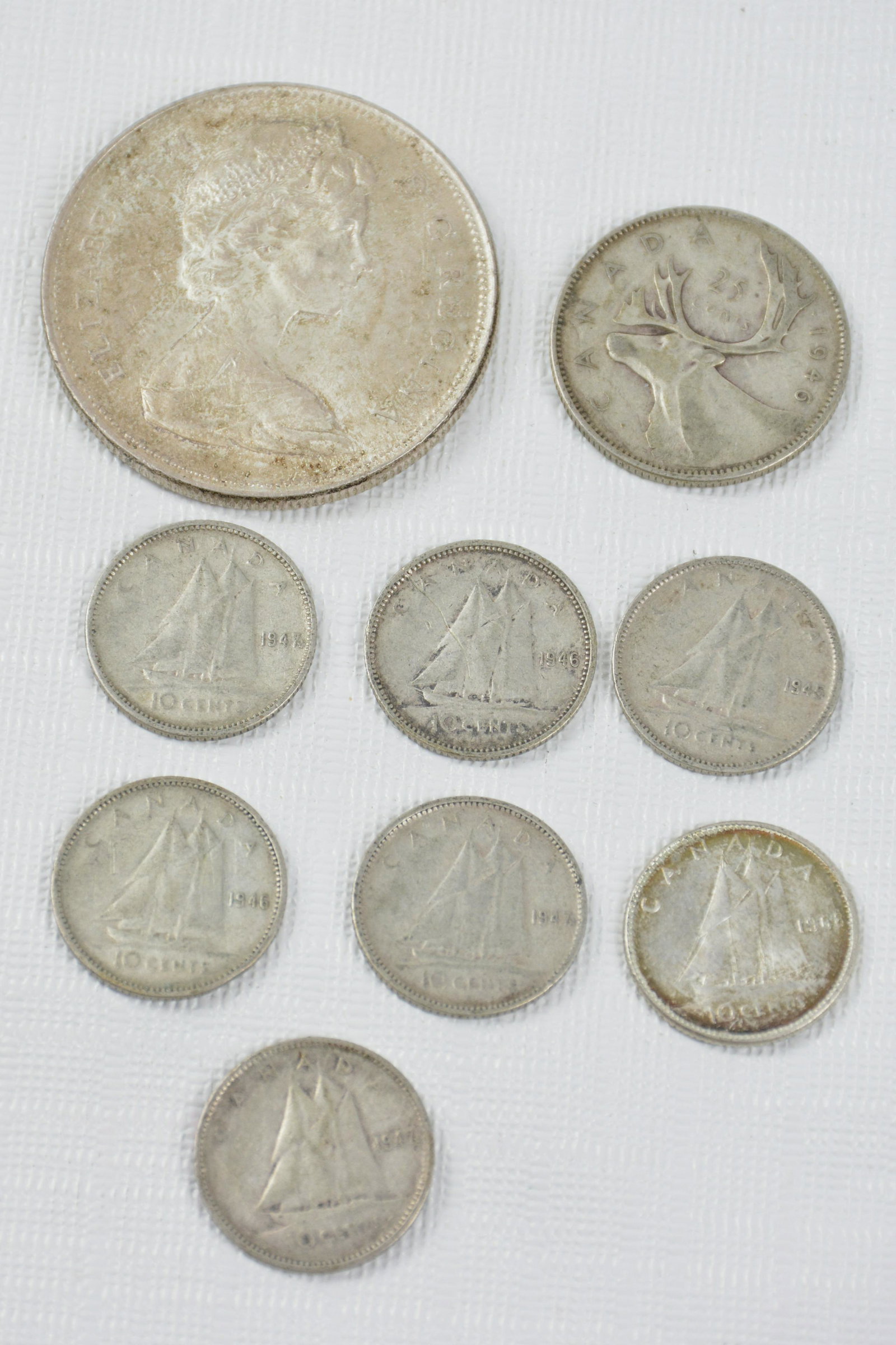 LARGE VARIETY OF CANADIAN SILVER COINS:  .10c - 1945, 46, 47, 68/ .25c - 1946/ 1$ 1960 (1 of 5)