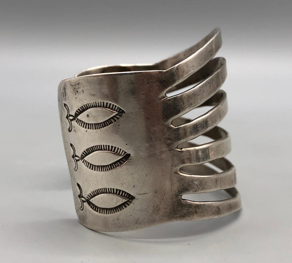 Vintage Wide Split Chisel Sterling Silver Bracelet: Available for your consideration is a vintage wide split chisel sterling silver bracelet. This exceptional bracelet features six split bands of silver on the face, with hand-stamped designs on either 