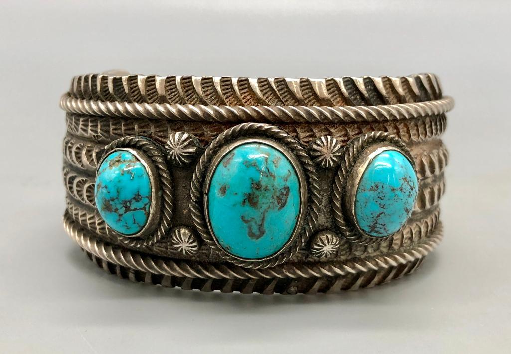Heavy Three Stone Bracelet by Emerson Bill: Offered here for your consideration is a heavy three-stone bracelet by Navajo artist, Emerson Bill. With three gorgeous turquoise cabochons at the center and heavily detailed silverwork, this sterling
