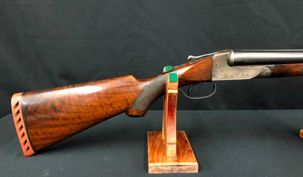 Engraved Ithaca 12 ga. SxS Double Barrel Shotgun: Up for sale in this lotÂ is an Ithaca Grade Two Flues Model 12 gauge with 30 inch barrels (mod/full). It has 2 3/4 inch chambers and a 14 1/2 length of pull. The barrels are in excellent shape retain