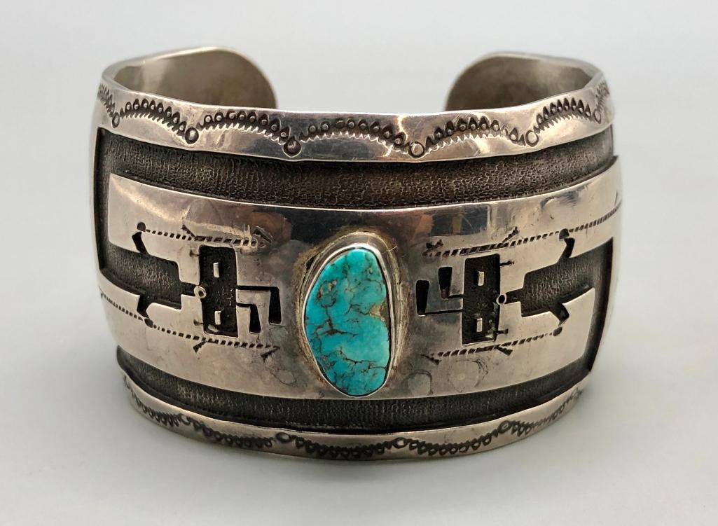 Rainbowman Overlay Sterling Silver & Turquoise Bracelet: Presented here for your consideration is a Rainbowman overlay sterling silver and turquoise bracelet. This bracelet is absolutely marvelous! It features a stunning turquoise cabochon at the center, wi