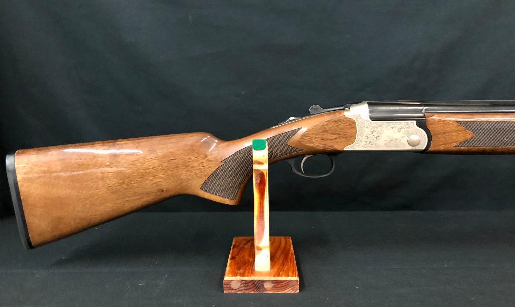Charles Daly Engraved 20 GA Shotgun: For sale in this lot is a beautiful Charles Daly, engraved 20 gauge, over/under double barrel shotgun. This shotgun is in great condition and is showing very little signs of use. The blued finish is v